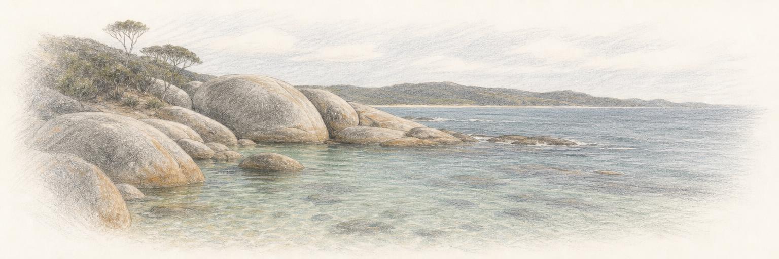 The granite boulders of Elephant Rocks rising from the calm shallows of Greens Pool, with the Southern Ocean beyond.