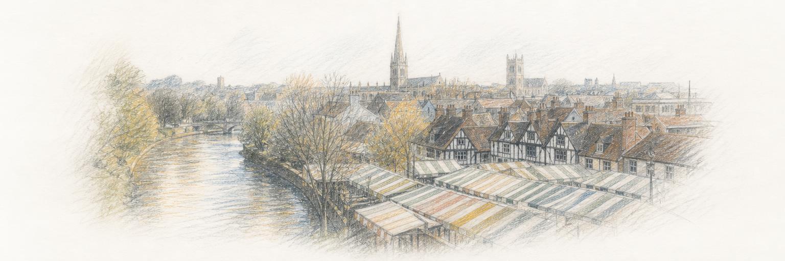 Norwich Market's striped stall roofs, with the old Lanes and the river bend behind.