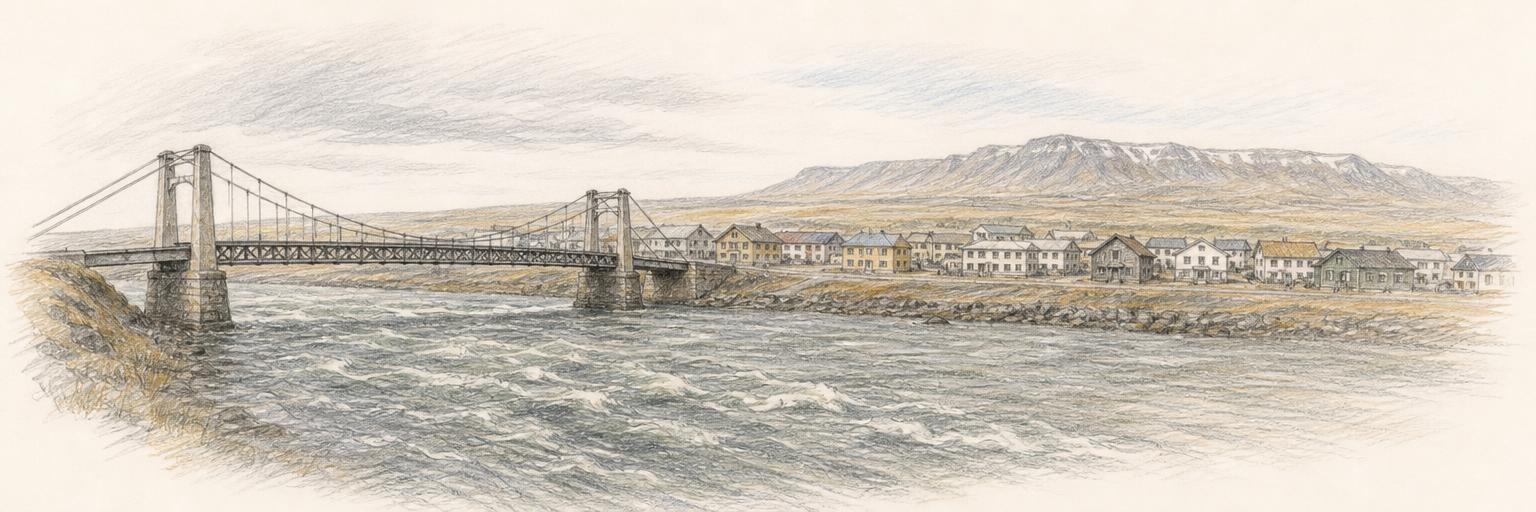 The old Ölfusá suspension bridge crossing the broad river, with the low riverside town of Selfoss on the far bank.