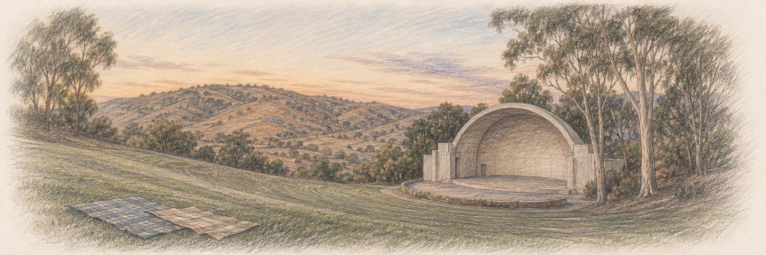 A colored-pencil sketch of Vista's Moonlight Amphitheatre at dusk: a grassy terraced hillside of open-air seating and a bare stage shell framed by trees below the dry inland hills.